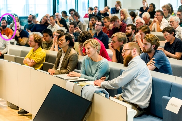 Photo of the workshop final symposium, with me in the circle in Pink